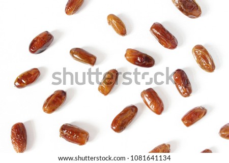 Styled stock photo. Ramadan desktop composition with date fruit on white background. Food pattern. Empty space. Flat lay, top view. 