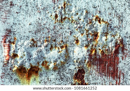 Old paint and rust. Old painted metal texture. Sheet of iron covered with rust. Grunge background. 