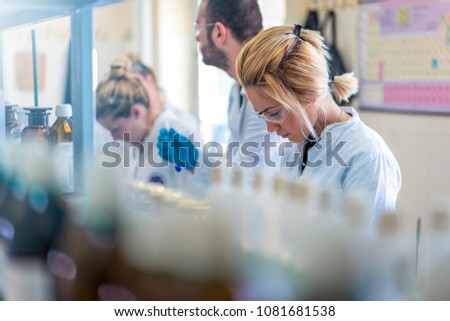 Young and beautiful female scientist working in laboratory doing some research Royalty-Free Stock Photo #1081681538