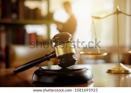 Judge gavel with Justice  lawyers having team meeting at law firm in background. Concepts of law. Royalty-Free Stock Photo #1081695923