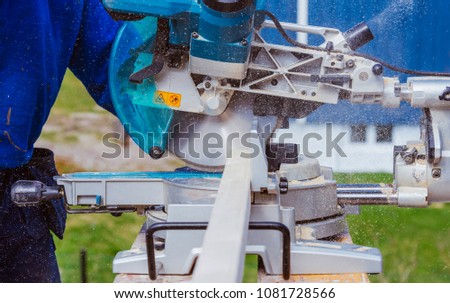 construction worker using with circular saw and plank. construction concept