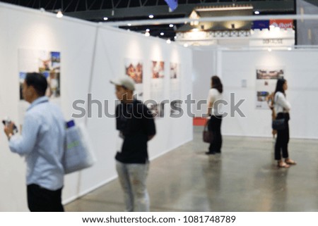 Indoor art and architecture gallery exhibition with blurred focus.