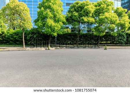 empty asphalt road and modern commercial office buildings in shanghai