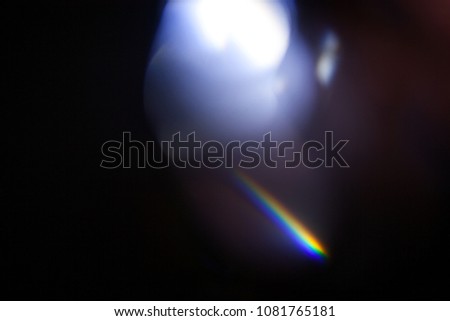 Real light leaks and lens flares shot on a black background. For photo retouch