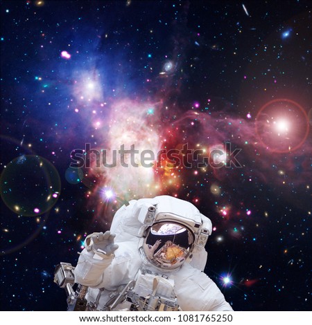 Astronaut and amazing starfield and nebula. The elements of this image furnished by NASA.
