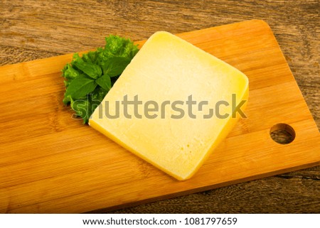 Parmesan cheese with salad leaves and basil
