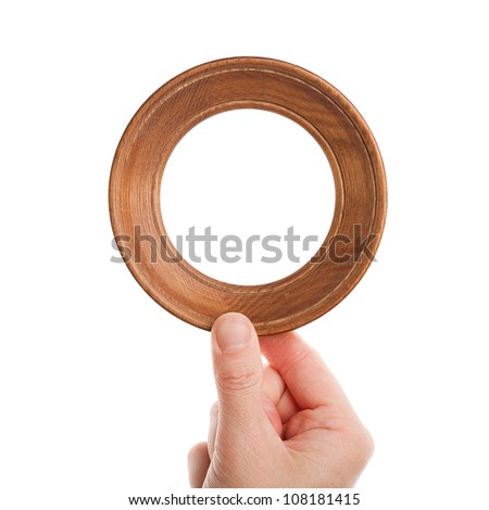Wooden frame in hand isolated on white background