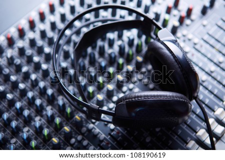 Headphones on soundmixer Royalty-Free Stock Photo #108190619
