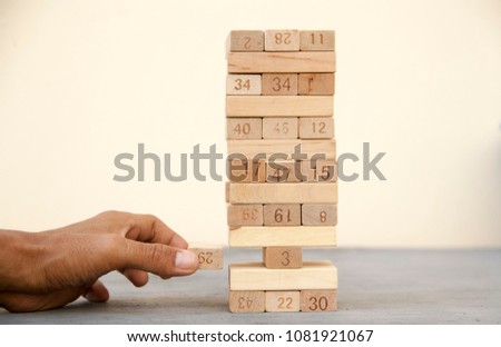 Wooden block in white background. Pull out the wooden brick with focusing. success concept. 