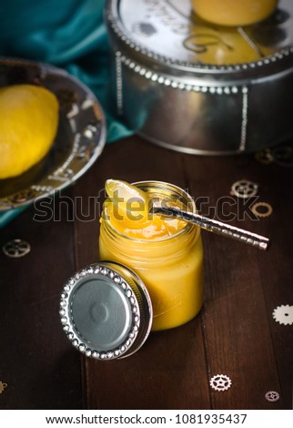delicious lemon cream curd yellow color on the teaspoon