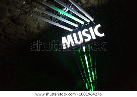 Bright lights in night club with music sign
