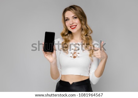 Young woman presenting telephone