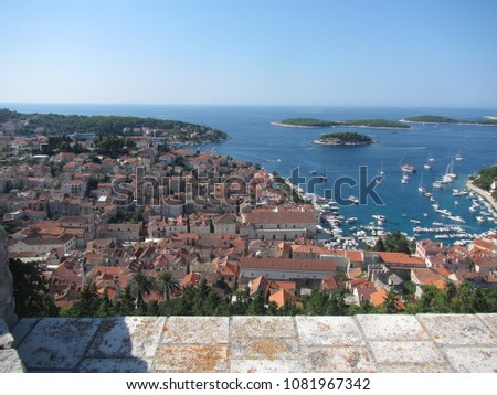 Diving overlook on the Old Town of Hvar City from the Fortress on a beautiful Summer day with Pakleni Otoci in the background - Croatia