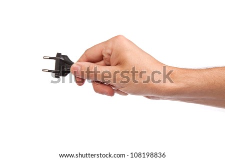 Man is holding a black outlet in the hand isolated on a white background