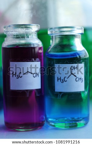 Technical alcohols. Purple color ethanol, blue isopropanol. Royalty-Free Stock Photo #1081991216