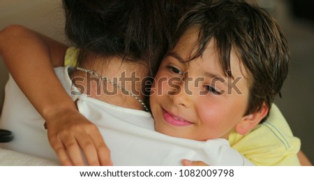 Child hugging older sister. Young boy hugs love family relative