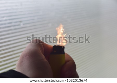 Lighter with sparkle and flame
