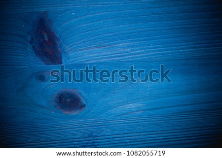 Navy blue wood texture and background for design. Old rustic wood table painted in blue. Vintage style.  