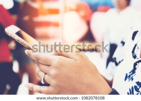 Closeup woman hands using smartphone contact and online social connection