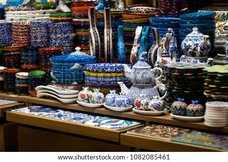 Colorful plates, cups and tea sets on market shelf’s