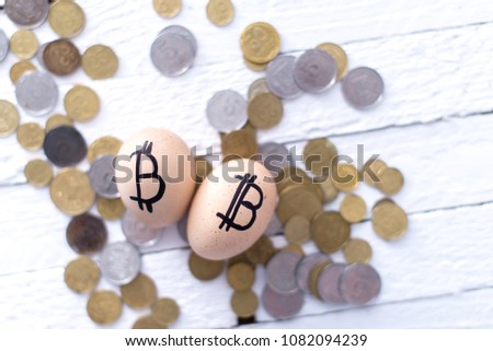 Egg with bitcoin on a white background. The concept of Crypto-currency