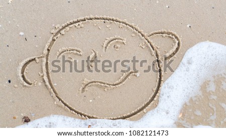 face of a funny angry man on the sand