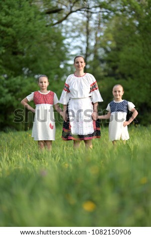 Young family posing in traditional Slovakian costume