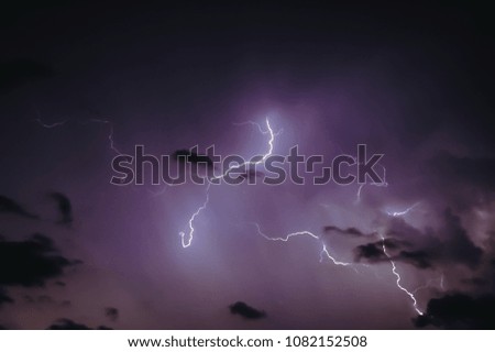 Dark sky lit up by lightning during thunderstorm in Warsaw, Poland
