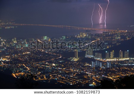 The photo combines 4 pictures taken during the 15 minute time-lapse shooting on Penang, it is interesting that the lightning strikes roughly the same and the same area covered with water 