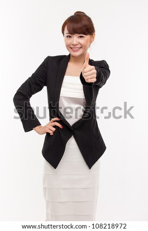 Successful happy Asian businesswoman showing thumb.
