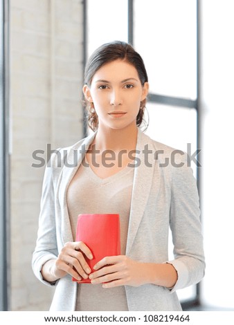 picture of calm and serious woman with book