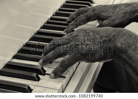 Nice closeup of a senior afro american man playing piano