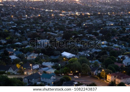 Beautiful View of a town in Auckland, New Zealand. Cloud sunset and town, View from Mt. Eden. Royalty-Free Stock Photo #1082243837