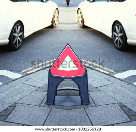 Traffic signage triangle stand scene.