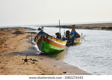 Fishing boat at beach back water background and backdrops 