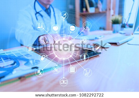 Medicine doctor or medical students with stethoscope using digital tablet laptop,Health Check with digital system support for patient with medical icon at hospital, Medical network technology concept.
