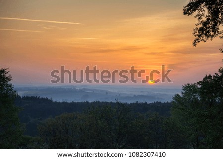 Sunrise over tree and mysty fog. Czech landscape