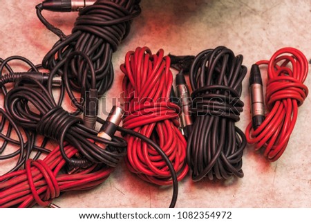 Audio cables for musical instruments and microphones on the floor