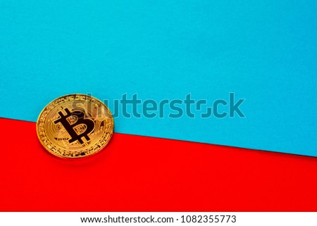 Bitcoin on colorful paper background with copy space