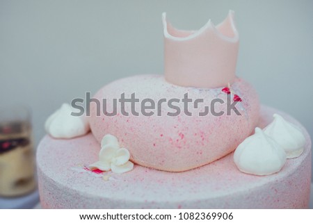 Heart shaped cake with sugar crown on the top 
