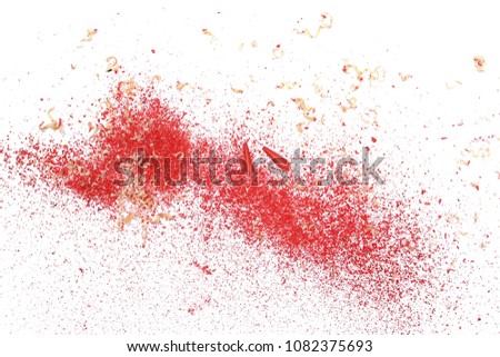 Wooden red pencil shavings from sharpener isolated on white background, top view
