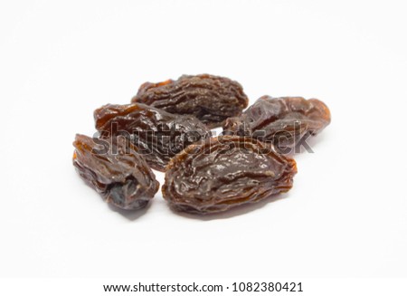 Dried  brown raisin, seeds Royalty-Free Stock Photo #1082380421
