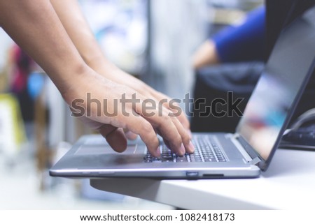 Business man using laptop computer. Male hand typing on laptop keyboard . Administrator working in data center configure and check internet network on computer laptop , troubleshooting center Royalty-Free Stock Photo #1082418173
