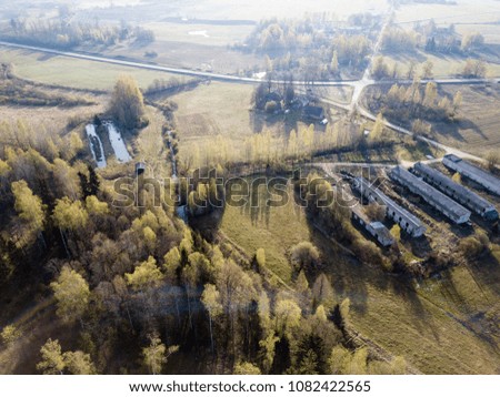 drone image. aerial view of rural area with fields and forests in sunny spring day. latvia