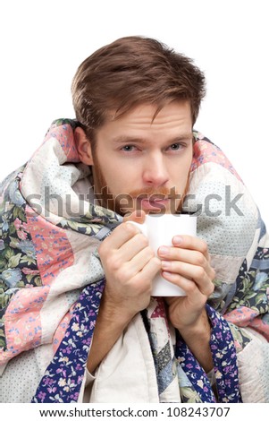 Sick young man holding cup of tea, isolated