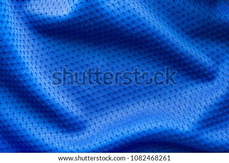 Blue color fabric sport clothing football jersey with air mesh texture background