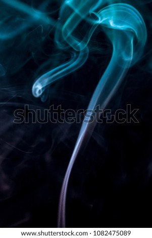 Colourful smoke on black background