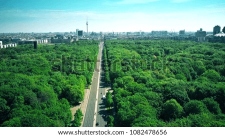 Aerial shot from Tiergarten in Berlin involving the Reichstag building, the Brandenburg Gate and the TV Tower, the most popular landmarks of the city
