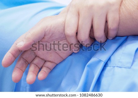 Touching hands Asian senior or elderly old lady woman patient with love, care, helping, encourage and empathy at nursing hospital ward : healthy strong medical concept 
