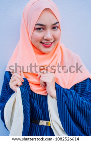 Fashion portraiture of young beautiful muslim woman wearing hijab